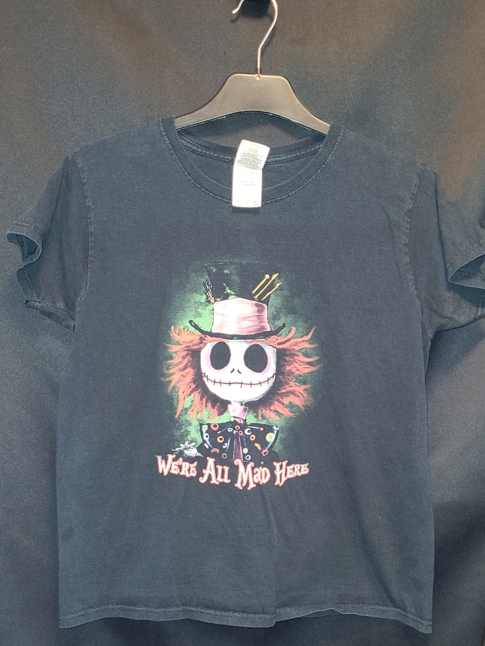 Jack Skellington styled as the Mad Hatter with the phrase "We're All Mad Here